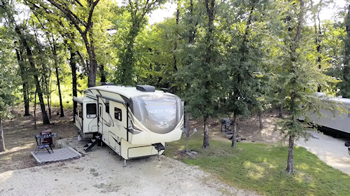 A typical RV site with a parked fifth wheel.
